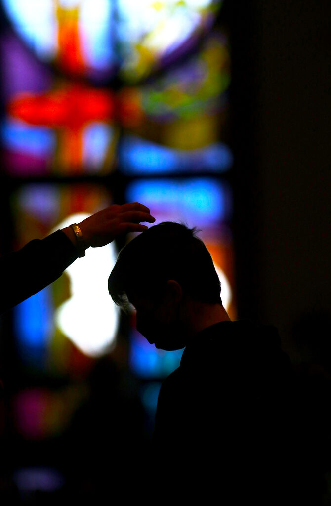 Dylan Davis receives ashes sprinkled on his head